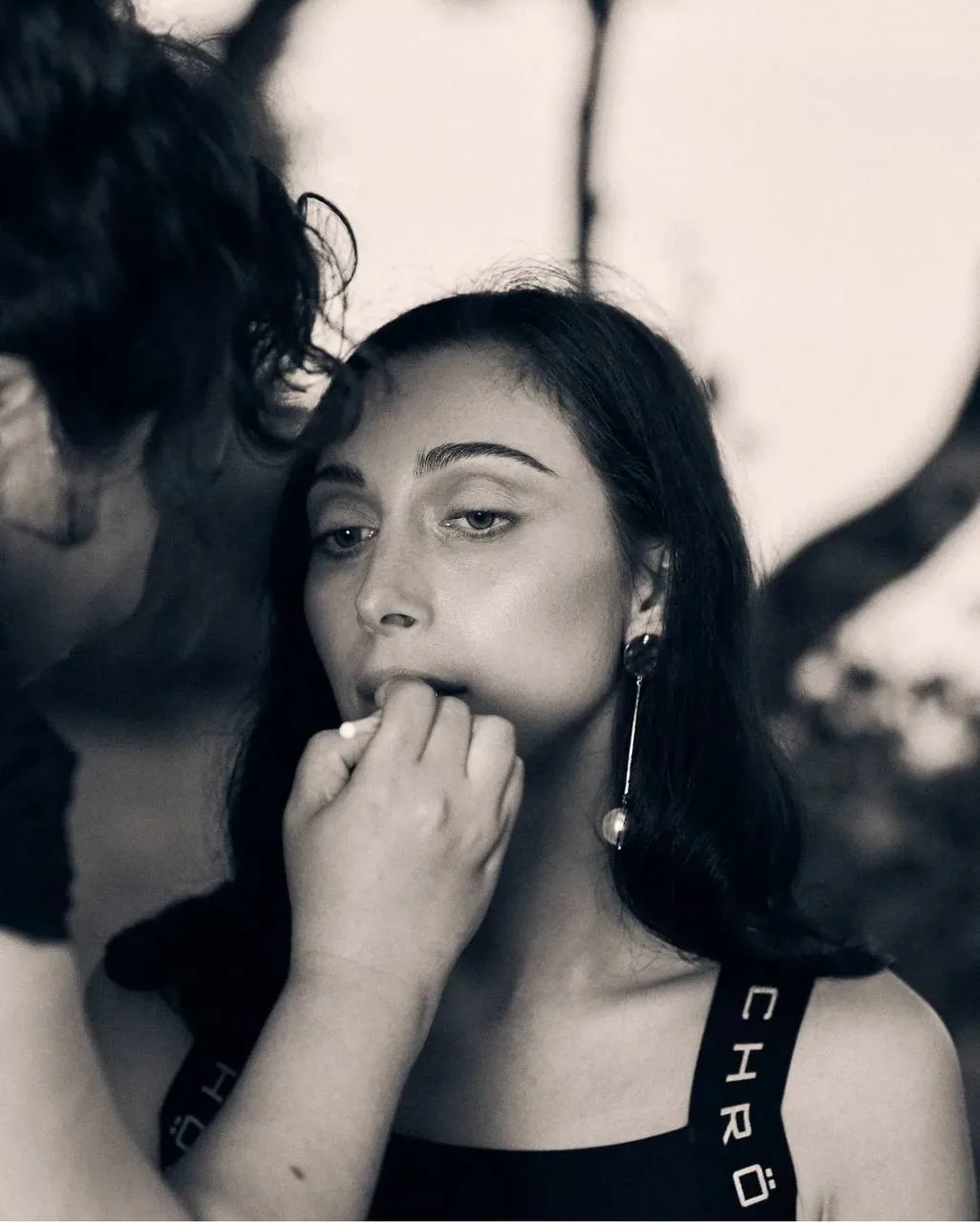 Applying makeup on client