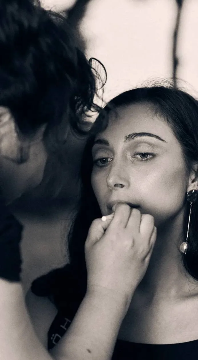 Applying makeup on client